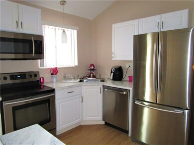 Updated kitchen with stainless steel appliances.