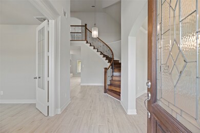 Welcome home! Your guests will experience the full effect of the grand entrance. The house radiates from the elegant entry with high ceilings, fresh paint, and tile look like wood floors. Schedule a tour or even a virtual tour!
