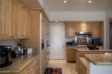 Kitchen with recessed lighting, backsplash, light
