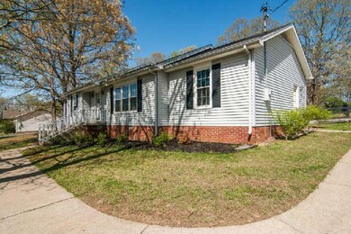 Mature trees offer shade on this beautiful corner lot