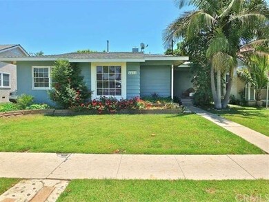 Grassy front lawn frames this classic Plaza area h