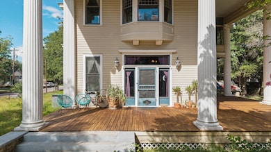 Property entrance with a wooden deck