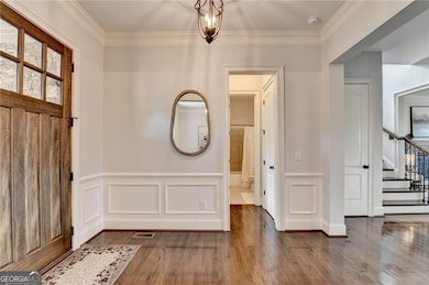Foyer with hardwoods.