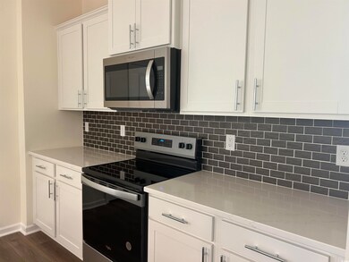 Kitchen with appliances with stainless steel finis