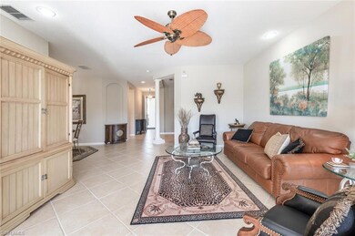 Living area with baseboards, recessed lighting, li