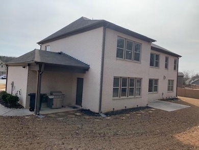 Back of property with a patio area