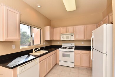 Light wood kitchen cabinets.