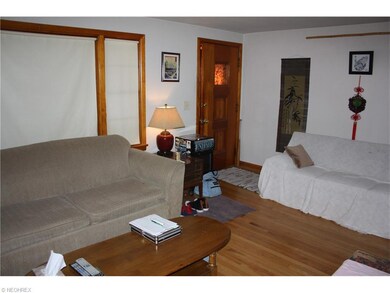 Living room, Huge windows look out on front porch.