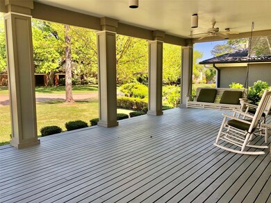Wooden terrace featuring ceiling fan
