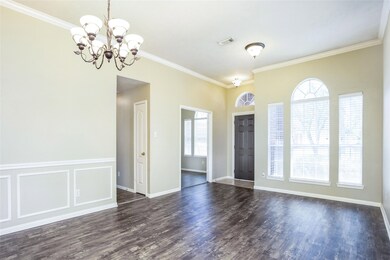 Entry opens into large combined formal living and dining areas.