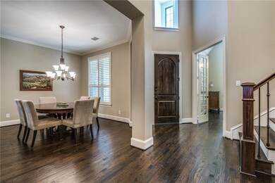Inviting entry with rich hand scraped wood floorin