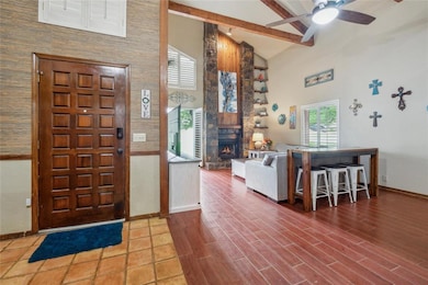 Looking into living area - those soaring ceilings with wood beams!