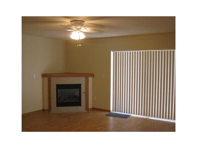 Living Room. Corner fireplace adds charm.