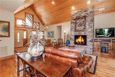 The floor to ceiling, rock fireplace takes center 