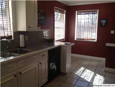 Lovely eat-in kitchen opens to dining room and den
