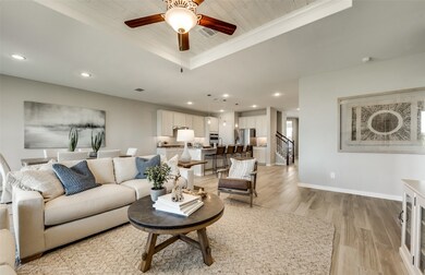 Open concept gathering room creating a spacious and inviting atmosphere *Model representation
