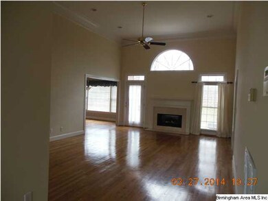 Living room with gas log fire place.  Hard wood fl