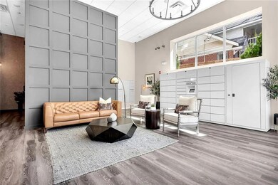 Living room with wood finished floors, a decorativ