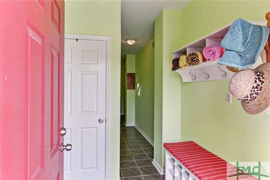 Welcome Foyer with places for shoes towels and hat