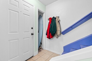 Interior space with light tile patterned flooring