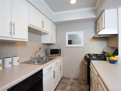 The kitchen ceiling has recessed lighting.