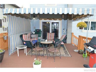 Exterior Back. DECK HAS ELECTRIC & SPEAKERS. AWNIN