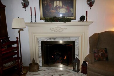Fireplace mantle highlights the marble hearth and 