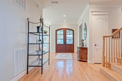 Spacious entry hall with formal dining room and the flex room located on either side upon entering the home.