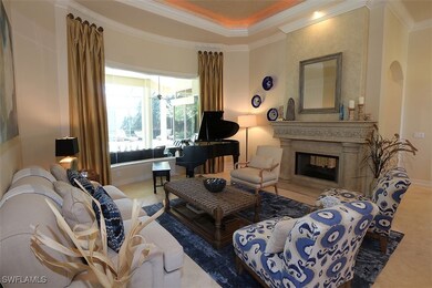 Living area with crown molding, carpet, a premium