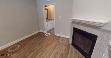 Detailed view of wood finished floors and a tiled