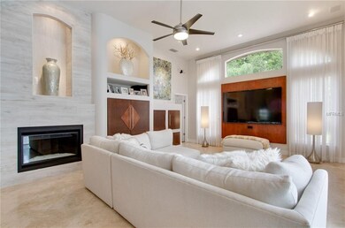 Family room with gas fireplace, art niches and bui