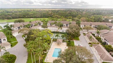 A community tennis court and pool is directly acro