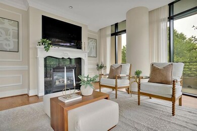 Living room with floor to ceiling windows, wood-ty
