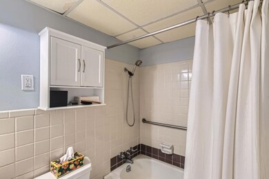 Full bathroom with shower / bath combination with