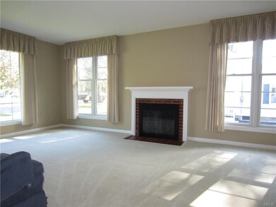 The formal Living Room is surrounded by younger ta