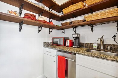 Mahogany open shelving  and dishwasher