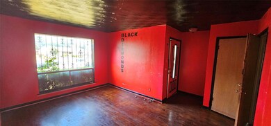 Unfurnished room featuring dark wood-type flooring