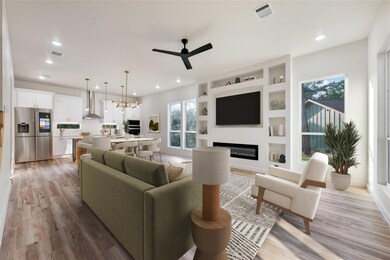 Living room with ceiling fan, a glass covered fir