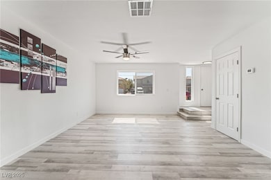 Empty room featuring wood finished floors, a ceili