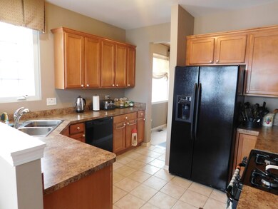 BLACK APPLIANCES, MAPLE CABINETS