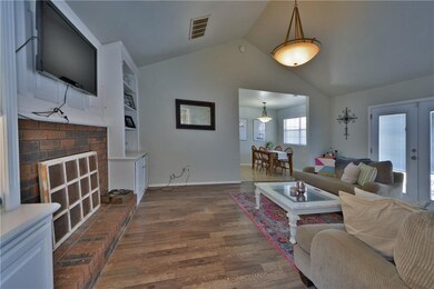 LIVING ROOM WITH VAULTED CEILING AND NEWER FLOORIN