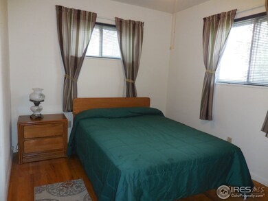 Bedroom with hardwood floors