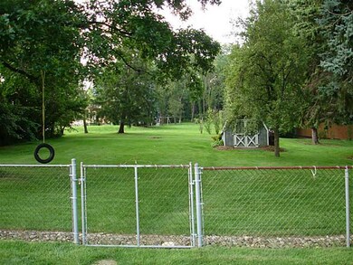 Yard/Garden. portion of yard is fenced - back port