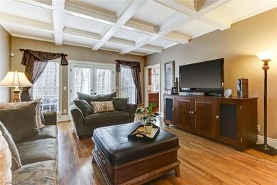 Living Room with Coffered Ceilings with access to extended back deck