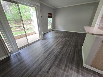 Unfurnished living room featuring dark wood-style