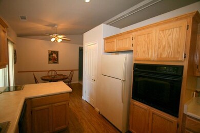 wall oven in oak cabinetry