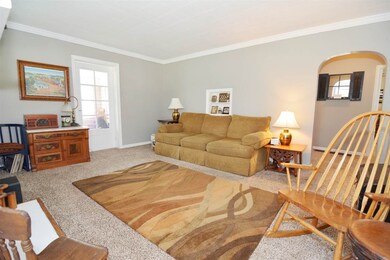 Cozy room with arched door way and tons of charm.