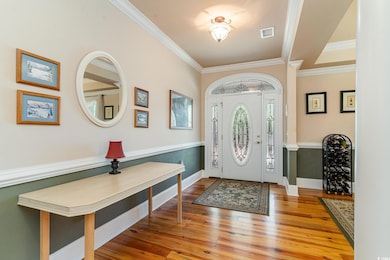 Entrance foyer with hardwood / wood-style floors a
