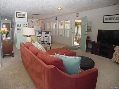 Living room is open to kitchen