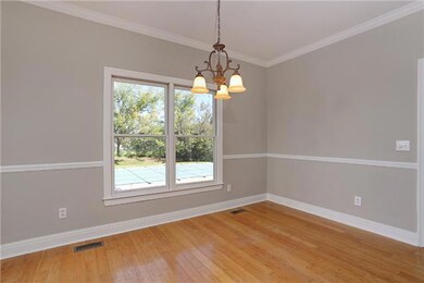 Adjacent to the kitchen on the other side is the dinning area, features hardwood flooring and lots of natural lighting. Home features all new lighting package.